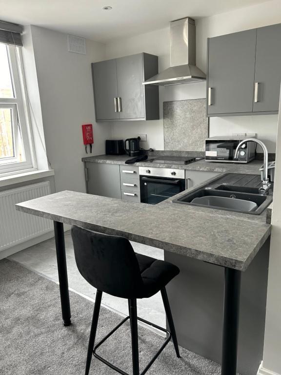 Modern breakfast bar kitchen in a Blackpool self-catering apartment